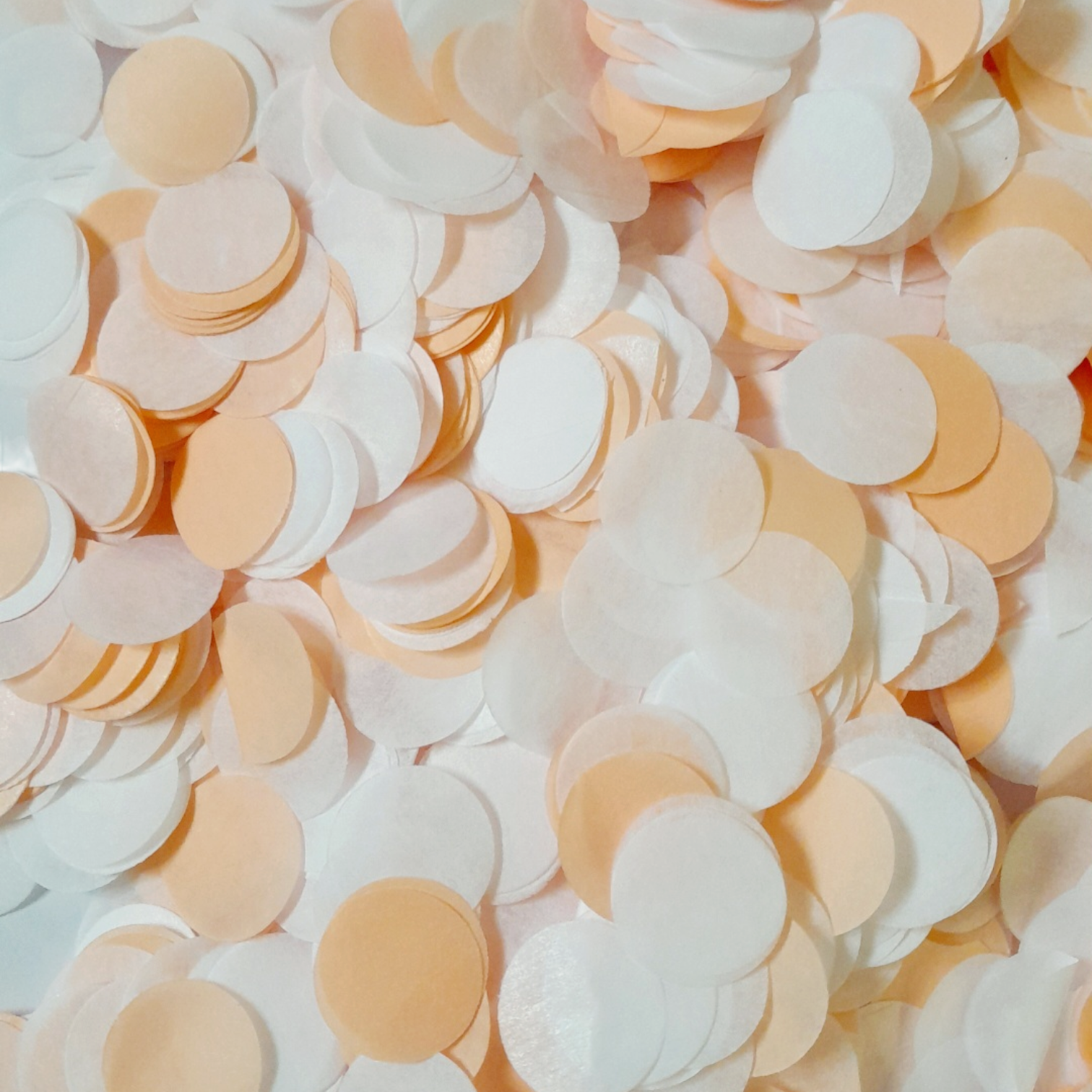 A two tone mix of Peach & White Coloured Tissue Paper Confetti Circles