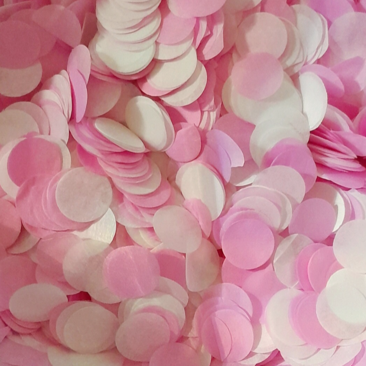 A two tone mix of Pink & White Coloured Tissue Paper Confetti Circles.